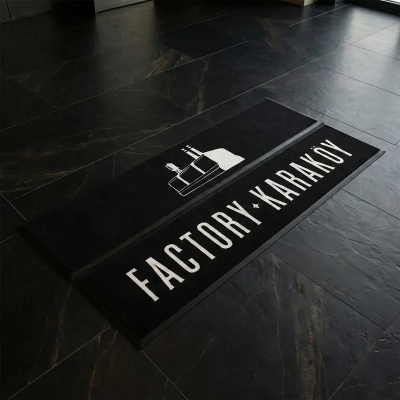 Kurumsal logolu paspas - Factory Karaköy için üretilen 31x173 siyah uzun paspas.